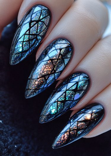 Stunning holographic stiletto nails with intricate stained glass patterns and vibrant colors.