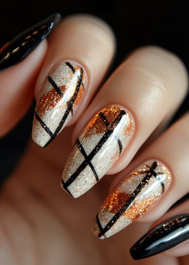 Chic black and white nail art with copper glitter on elegant almond-shaped nails.