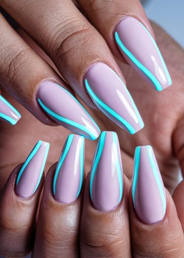 Stylish pastel pink coffin nails with vibrant neon blue accents for modern nail art inspiration.