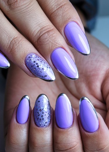 Stunning lavender chrome nails with glitter and metallic tips showcasing elegant nail art.