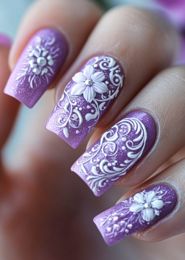 Elegant lavender floral nail art with intricate designs and shimmering details.