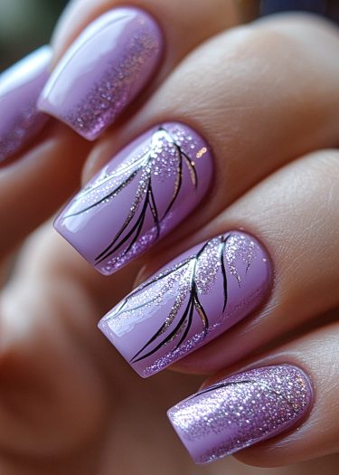 Elegant lavender nail art with glitter and intricate black designs for a sophisticated look.