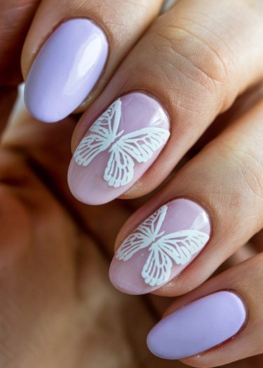 Elegant lavender glossy nails with intricate butterfly designs for a stylish manicure.