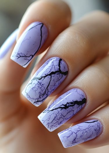 Sophisticated lavender marble nails featuring intricate vein patterns for a modern manicure.