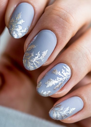 Elegant lavender matte nail art with intricate metallic floral designs for sophisticated style.