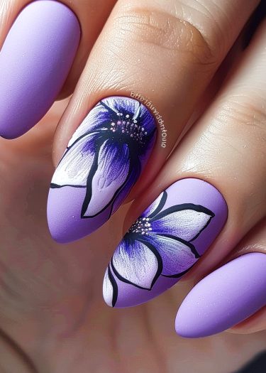 Elegant lavender matte nails with intricate floral designs for stunning nail art inspiration.