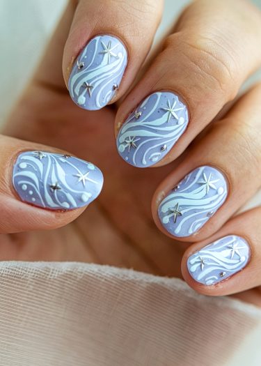 Delicate lavender nail art featuring swirling patterns and star embellishments for a chic look.