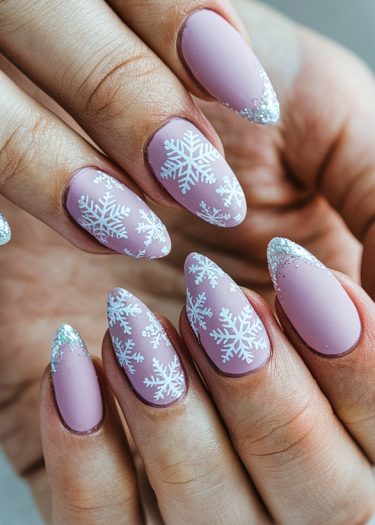 Elegant lavender snowflake nail art with shimmering tips for a classy winter look.