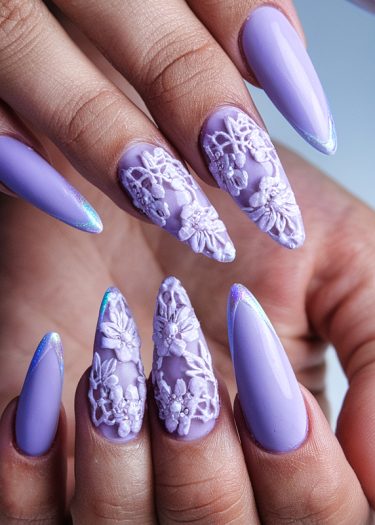 Lavender stiletto nails with 3D floral art showcase elegant nail design and artistry.