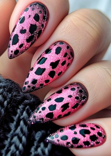 Vibrant pink leopard print nail design with glitter, perfect for bold fashion statements.