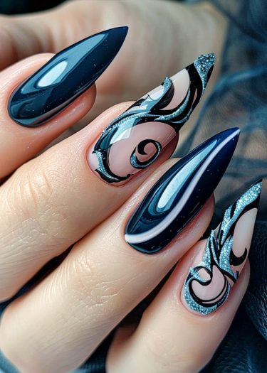 Elegant long black stiletto nails featuring intricate swirl designs and sparkling silver accents.