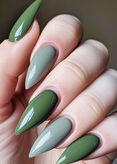 Elegant green stiletto nails showcasing flawless manicure and sophisticated design.