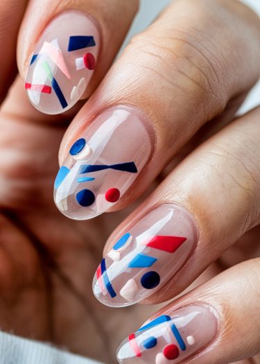 Artistic almond-shaped nails with colorful geometric abstract designs on a nude base.