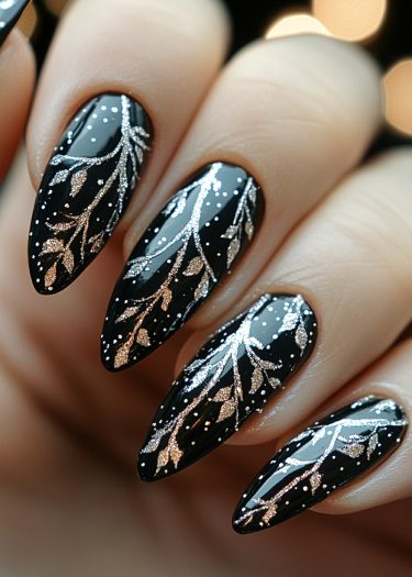 Elegant black almond-shaped nails with silver glitter art and white dots against a warm background.