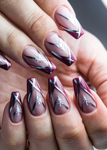 Elegant almond-shaped acrylic nails with bold stripes and botanical designs in rich colors.