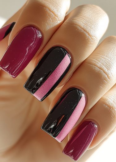 Elegant maroon and two-tone black and rose pink nail art on well-manicured hands.