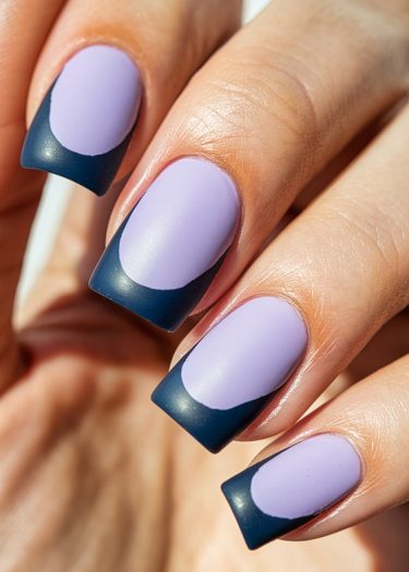 Stylish matte lavender and navy nail art with a modern design and squared shape.