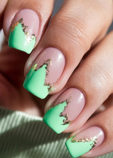 Elegant mauve and mint gradient nails with gold foil accents for a stunning nail art design.