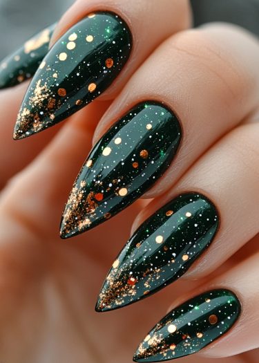 Elegant metallic green stiletto nails with shimmering glitter and starry accents for a glamorous look.