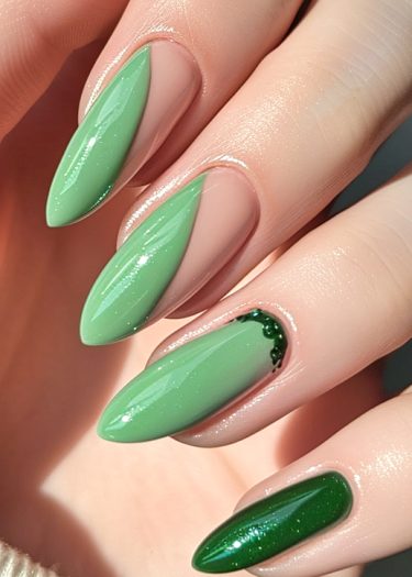 Elegant mint green nail art with unique designs and embellishments for a stylish manicure.