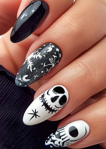 Elegant monochrome nail designs with horror elements featuring skulls and celestial motifs.