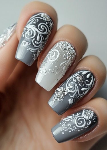 Elegant monochrome nail art with intricate designs, gradients, and sparkling rhinestones.