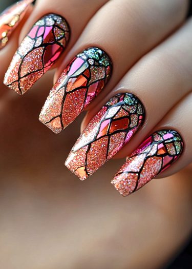 Intricate stained-glass nail art featuring vibrant colors and glitter for a luxury manicure.