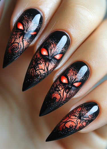 Elaborate stiletto nails featuring gothic designs and glowing orange-red eyes for a mystical look.