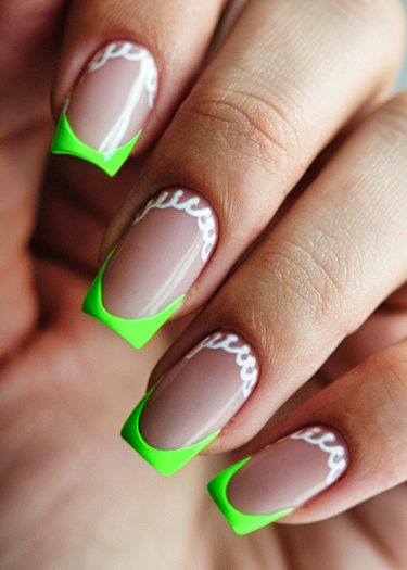 Vibrant nude manicure with neon green French tips and intricate white scallop designs.