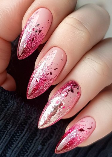 Stiletto nails featuring nude pink base and vibrant pink glitter for a glamorous look.