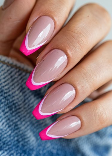 Elegant nude-pink manicure with glossy finish, almond shape, and trendy design on manicured nails.