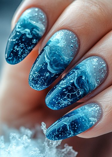 Intricate ocean wave nail art with vibrant blue tones and glossy finish.