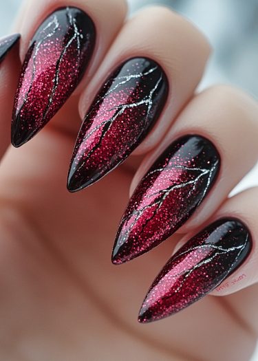 Ombre black and red glitter nail art with elegant silver lightning bolt design.