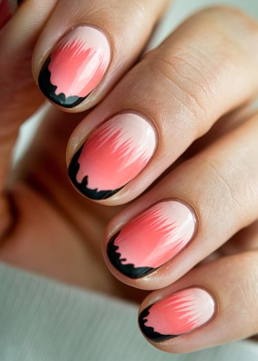 Intricate ombre coral nail art with bold black tips, showcasing vibrant gradient designs.