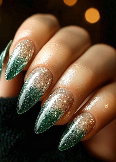 Elegant ombre green glitter nails with stiletto shape, perfect for a bold fashion statement.