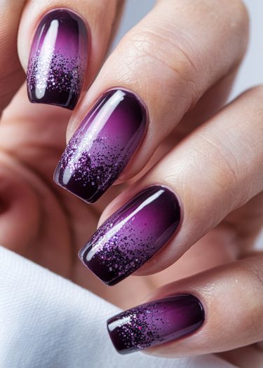 Elegant ombre purple glitter nails with a glossy finish and stylish square shape.