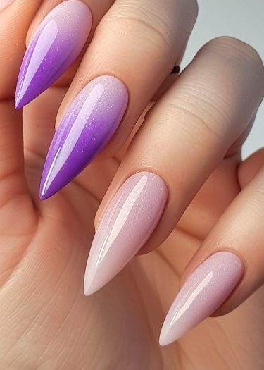 Elegant ombre pink and purple nail art with glitter and almond shape design.