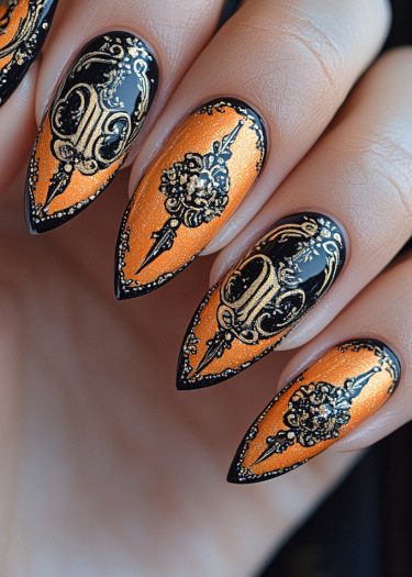 Vibrant orange and black baroque nail art with gold accents on long almond-shaped nails.