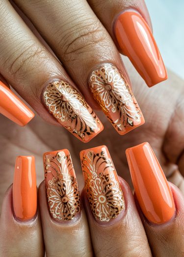 Vibrant orange floral nail art showcasing intricate designs on long, glossy nails.