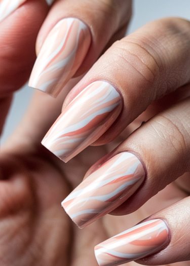 Elegant pastel abstract nail art design on manicured square-tipped nails in soft hues.