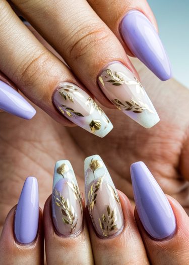 Exquisite pastel lavender coffin nails with gold floral designs and high-gloss finish.