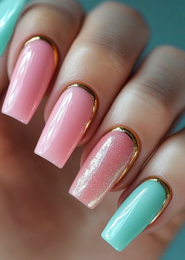 Elegant pastel nail art with gold accents and glitter for a chic, sophisticated look.