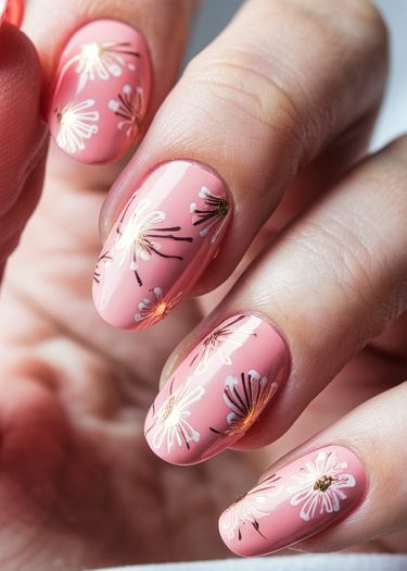 Sophisticated pastel pink floral nail art featuring delicate designs and elegant detailing.