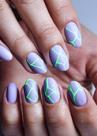 Lavender nails with vibrant neon green geometric nail art design for a modern manicure.