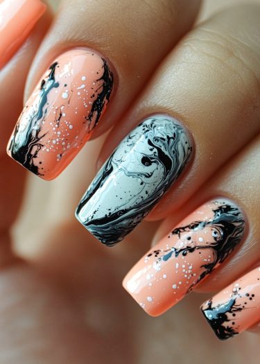 Vibrant peach marble nail art with black and white accents for a stylish manicure.