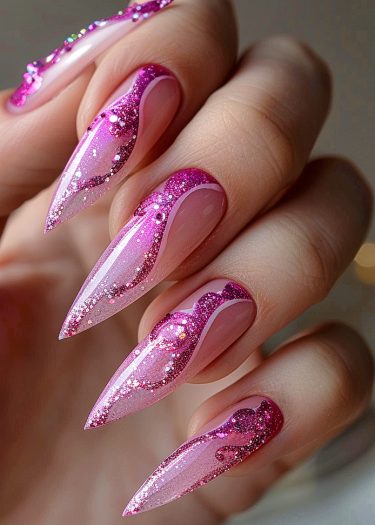 Stunning stiletto nails with pink glitter and flame design for an elegant nail art look.