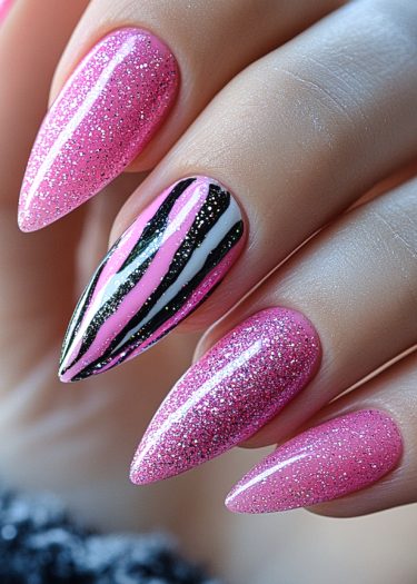 Vibrant pink glitter almond nails with artistic stripes create a chic and glamorous look.