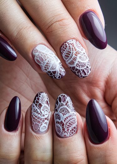 Elegant burgundy and white lace nail art design for sophisticated and stylish manicured nails.