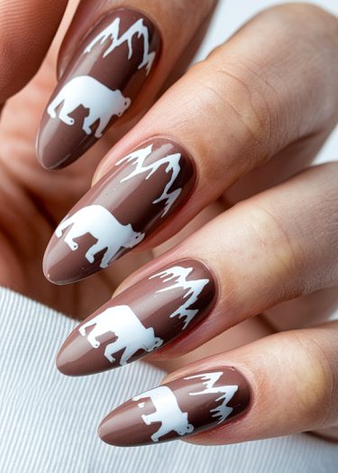 Elegant brown polar bear nail art with intricate designs for a sophisticated look.