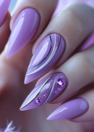 Vibrant lilac stiletto nails with intricate patterns and rhinestones for a glamorous manicure.